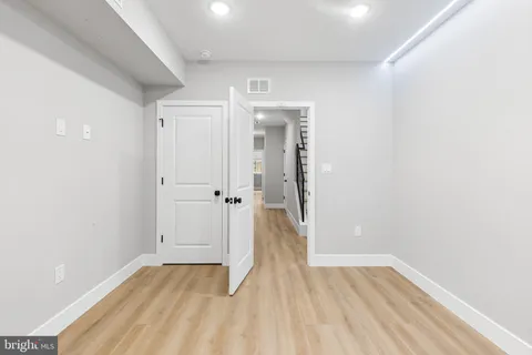 a view of a hallway with washer and dryer
