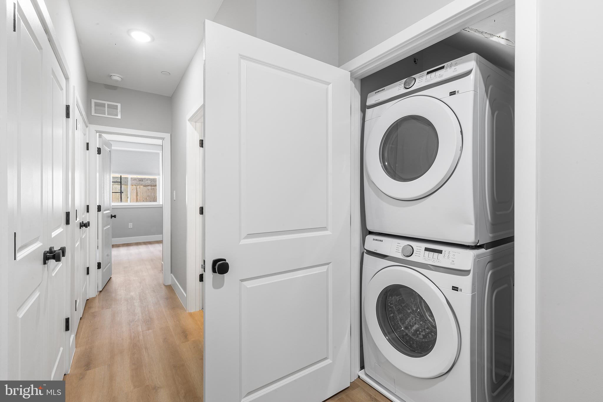 1413 North 8th Street Philadelphia, PA 19122 - Photo 39 of 44 a view of a hallway with washer and dryer