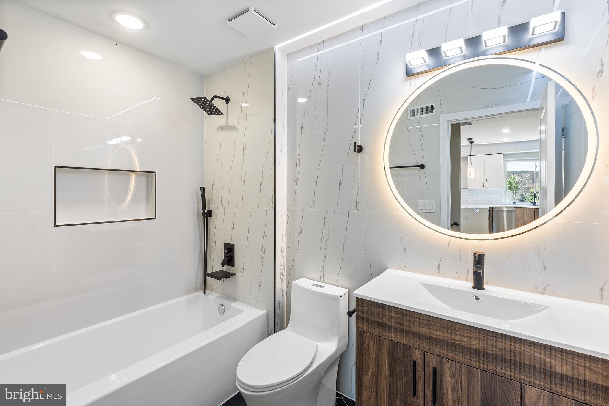 1413 North 8th Street Philadelphia, PA 19122 - Photo 8 of 44 a bathroom with a toilet a sink a mirror and bathtub