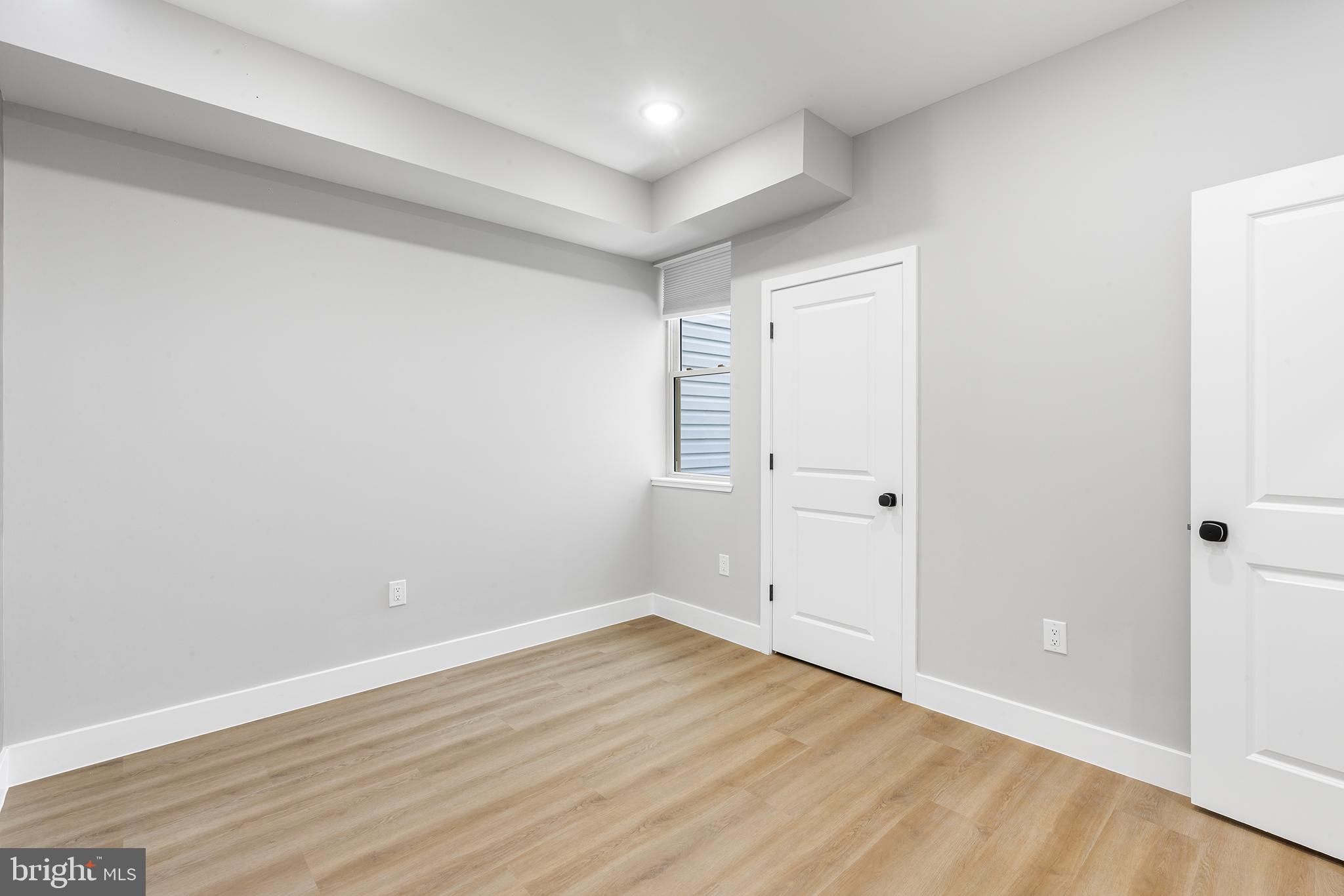 1413 North 8th Street Philadelphia, PA 19122 - Photo 10 of 44 a view of an empty room with wooden floor