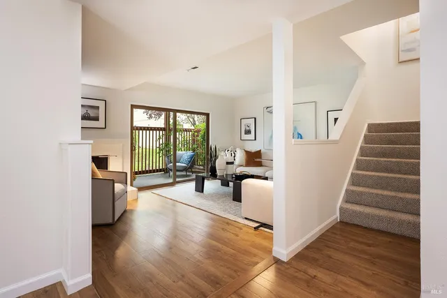 a view of a livingroom with furniture and a window