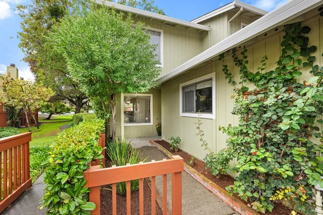 a view of a house with a small yard