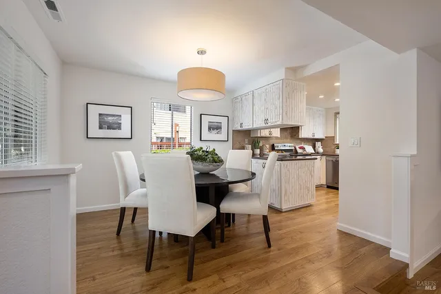 a view of kitchen with cabinets and wooden floor