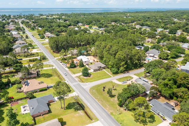 an aerial view of residential houses with outdoor space
