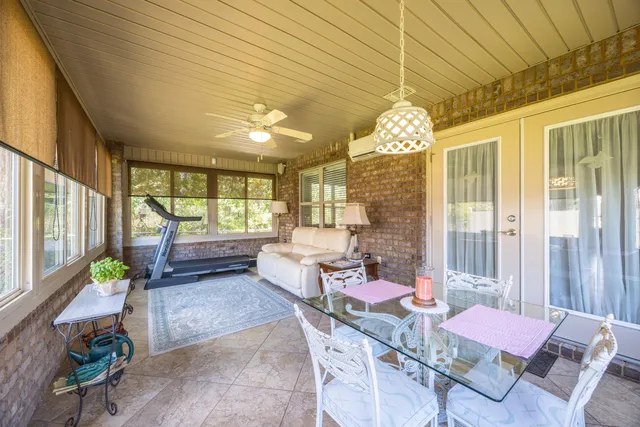a dining room with furniture and window