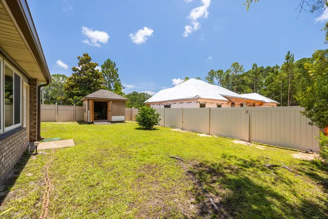 a house with swimming pool in front of it