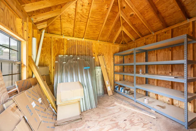 a view of a swimming pool with a yard