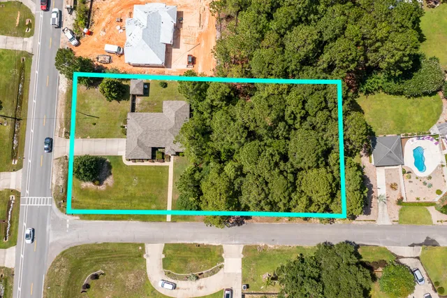 a front view of house with yard and outdoor seating