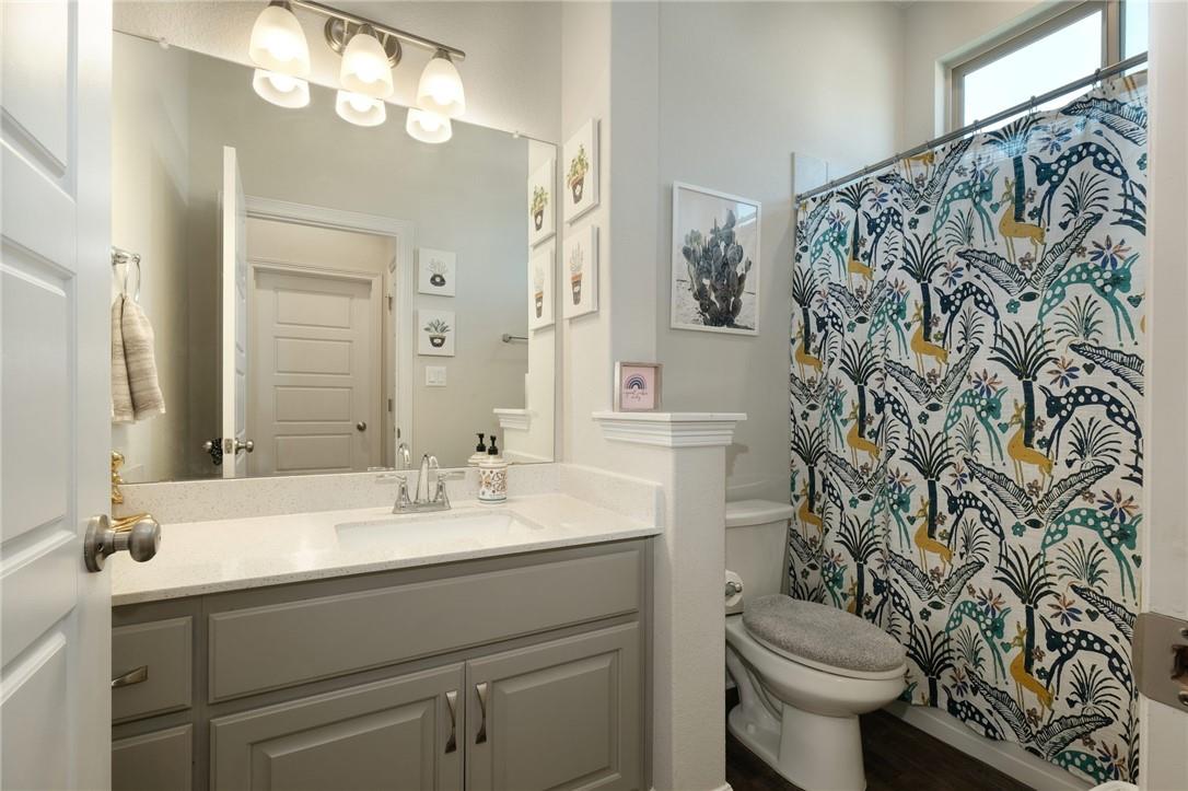 229 Bonnet Boulevard Georgetown, TX 78628 - Photo 13 of 20 a bathroom with a sink toilet and shower