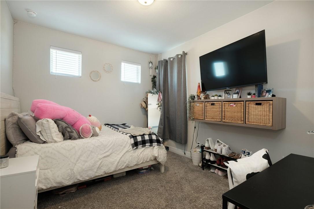 229 Bonnet Boulevard Georgetown, TX 78628 - Photo 17 of 20 a living room with furniture and a flat screen tv
