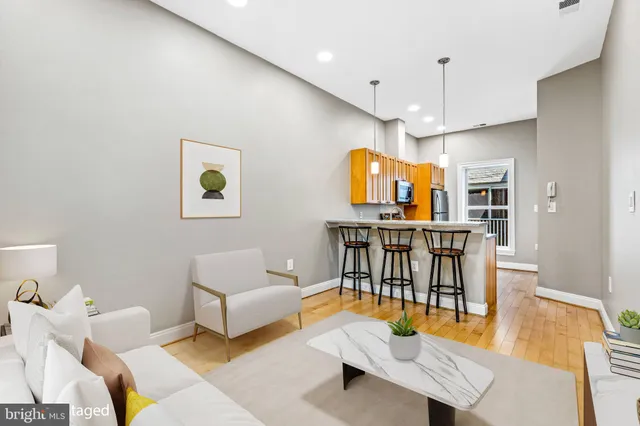 a living room with furniture and a table