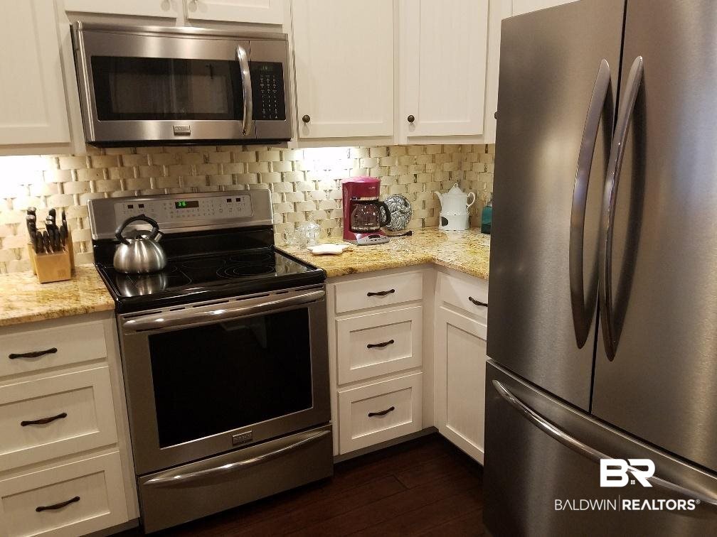 25773 Canal Road, Unit 41 Orange Beach, AL 36561 - Photo 8 of 34 SS appliances with plenty of cabinets