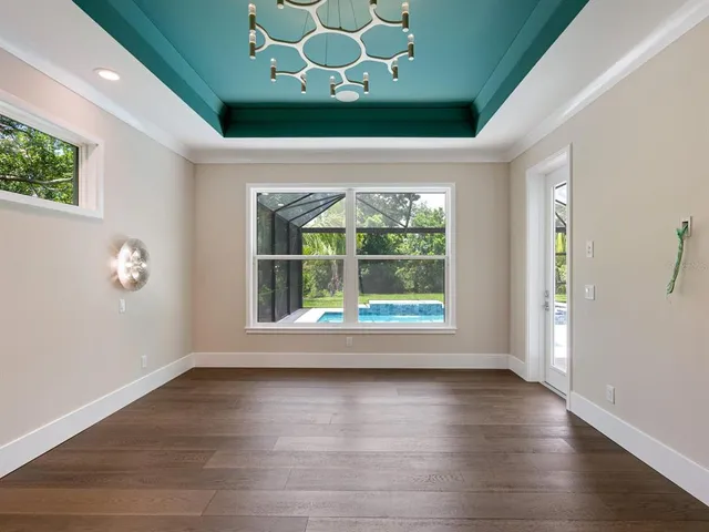 a kitchen with white cabinets a sink and a stove