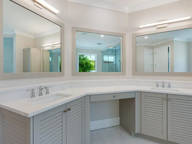 a view of a patio with table and chairs under an umbrella