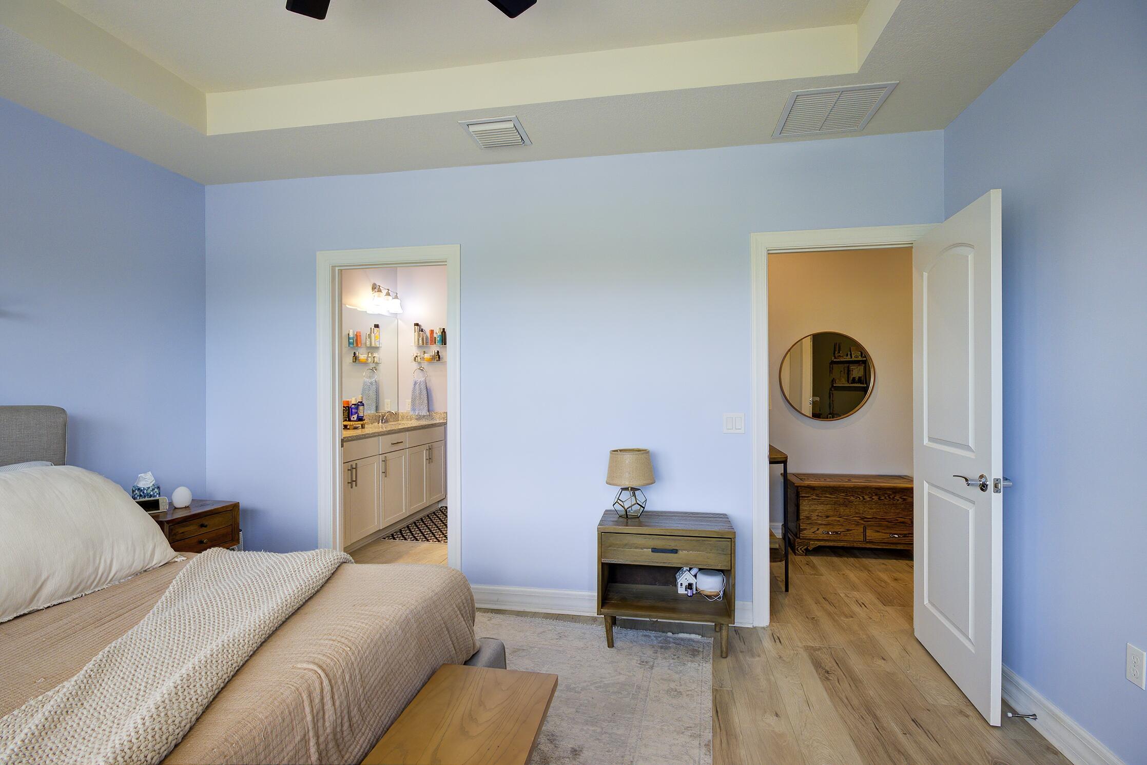 8327 Rearing Lane Lake Worth, FL 33467 - Photo 11 of 31 a bedroom with furniture and a wooden floor