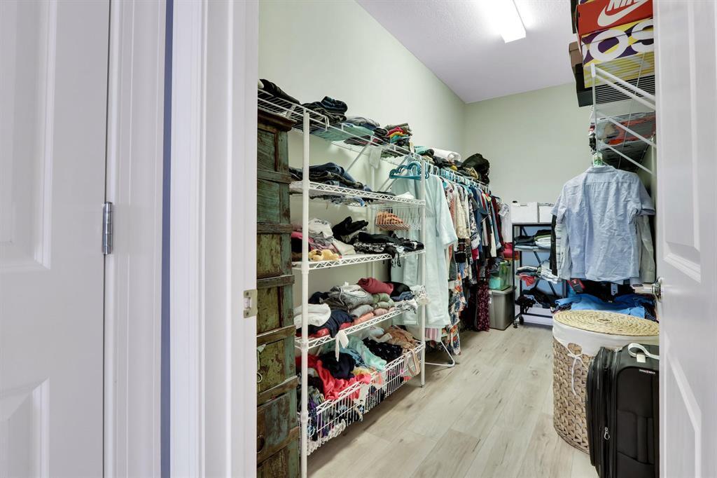 8327 Rearing Lane Lake Worth, FL 33467 - Photo 13 of 31 a view of walk in closet with clothes and shoes