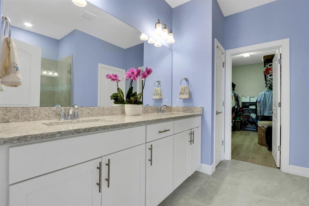 8327 Rearing Lane Lake Worth, FL 33467 - Photo 14 of 31 a bathroom with a granite countertop sink and a mirror