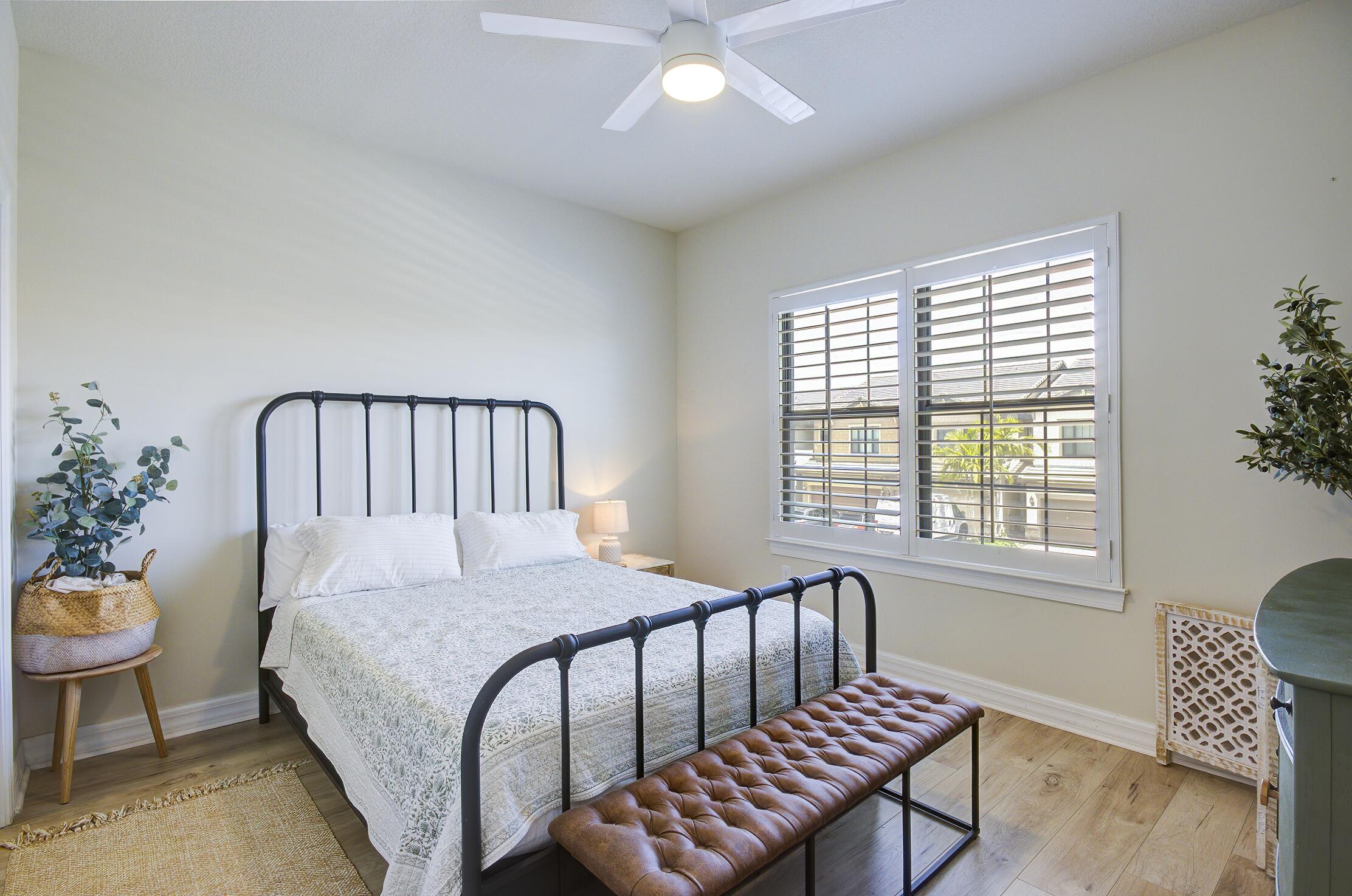 8327 Rearing Lane Lake Worth, FL 33467 - Photo 17 of 31 a bedroom with a bed and a window