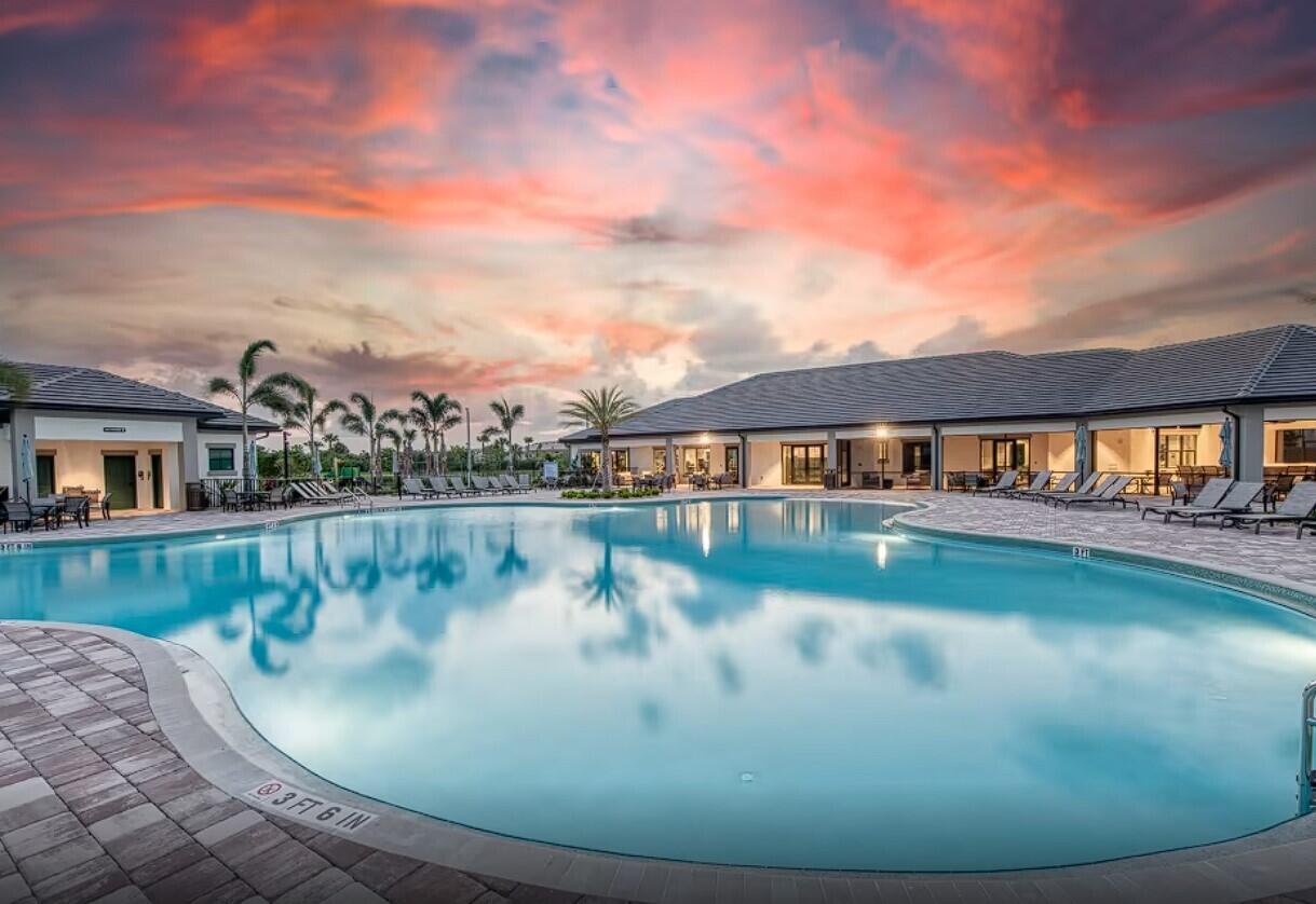8327 Rearing Lane Lake Worth, FL 33467 - Photo 26 of 31 a view of swimming pool with a yard from a tub