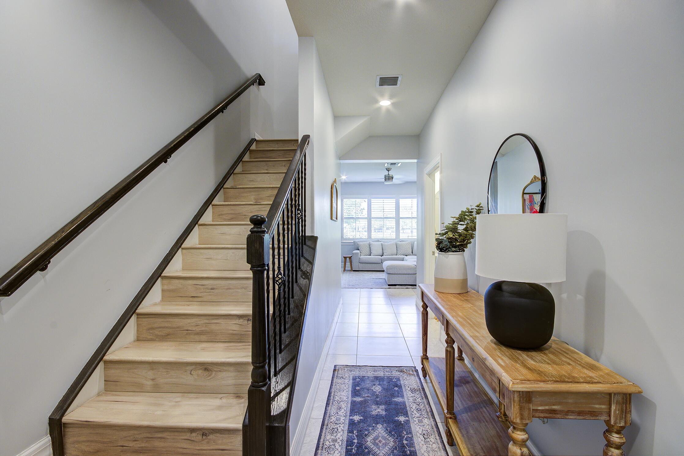 8327 Rearing Lane Lake Worth, FL 33467 - Photo 3 of 31 a view of entryway and hall with wooden floor