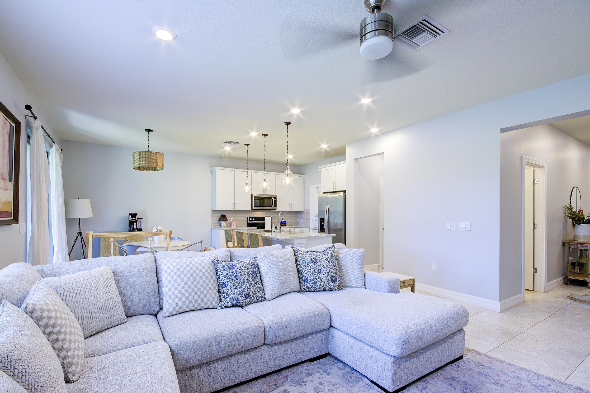 8327 Rearing Lane Lake Worth, FL 33467 - Photo 5 of 31 a view of a living room kitchen and a wooden floor