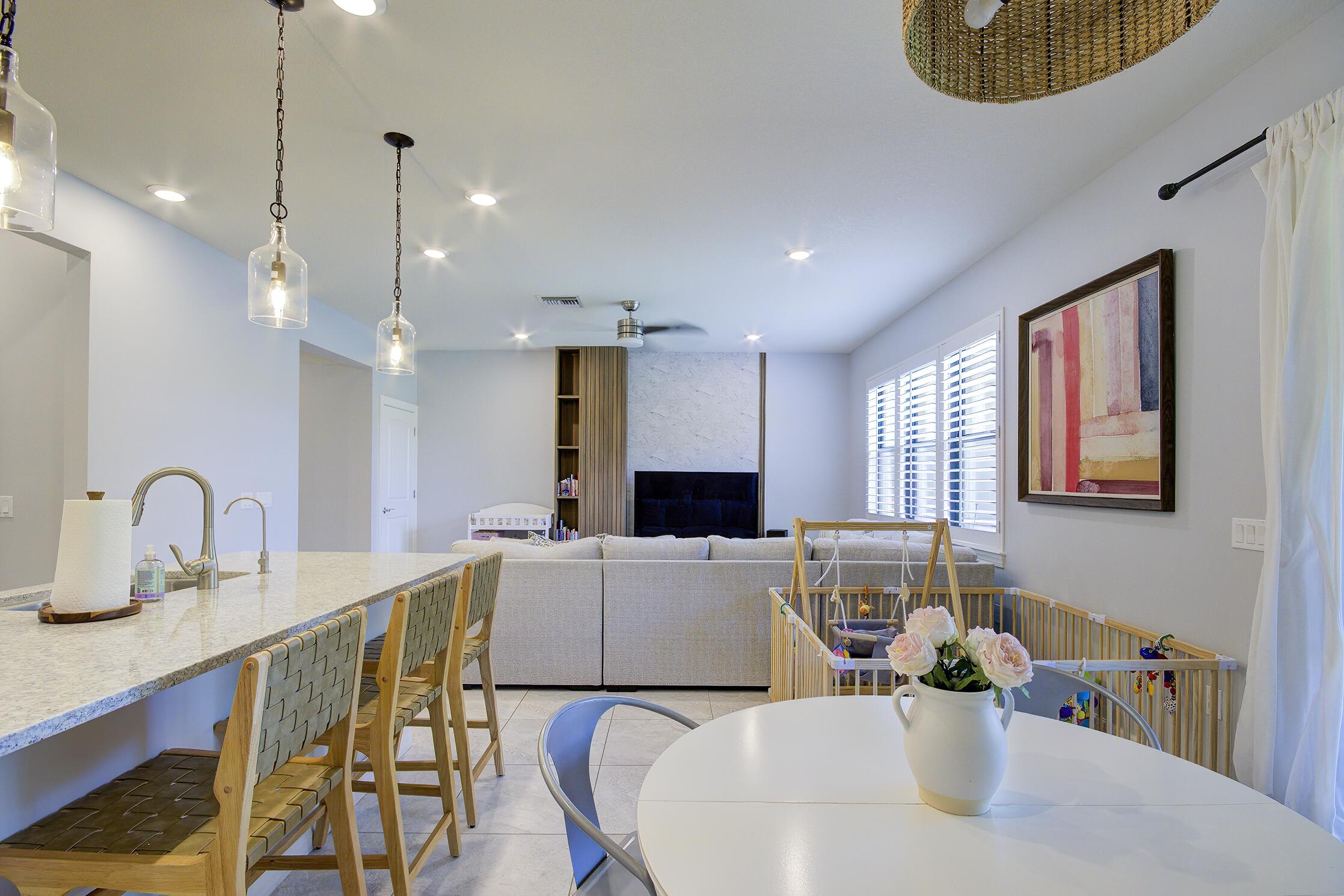 8327 Rearing Lane Lake Worth, FL 33467 - Photo 6 of 31 a large kitchen with a table and chairs
