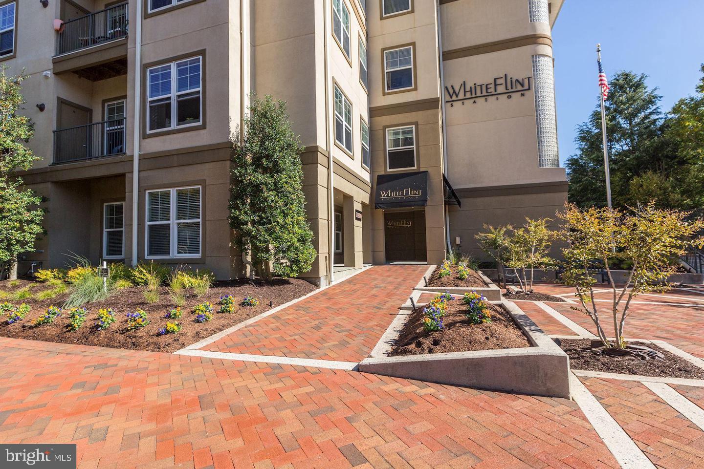 11800 Old Georgetown Road, Unit 1206 Rockville, MD 20852 - Photo 3 of 27 a view of a house with potted plants
