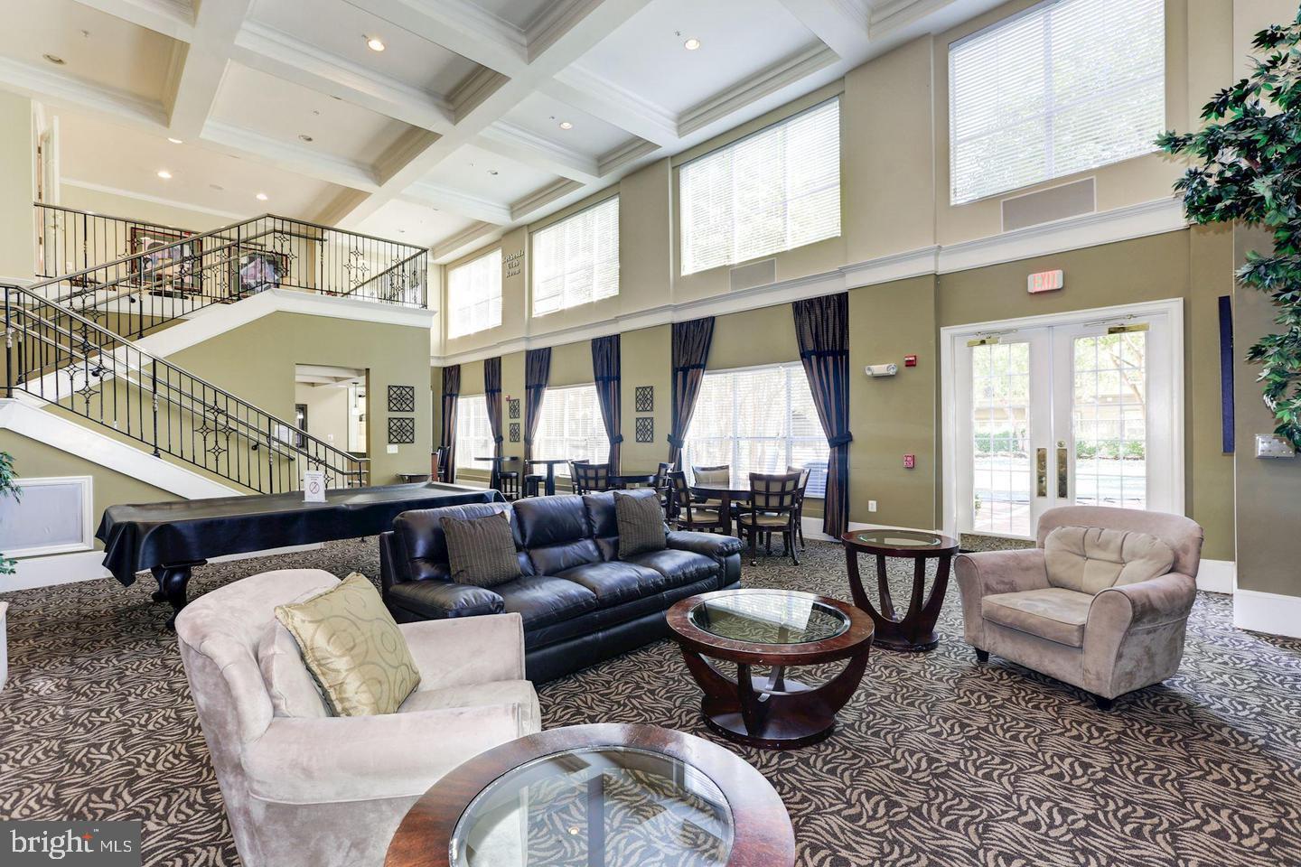 11800 Old Georgetown Road, Unit 1206 Rockville, MD 20852 - Photo 8 of 27 a living room with furniture and a large window