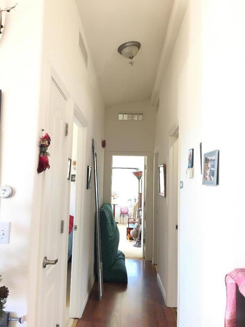580 Russell Ridge Watsonville, CA 95076 - Photo 33 of 50 a view of a hallway with bathroom and wooden floor
