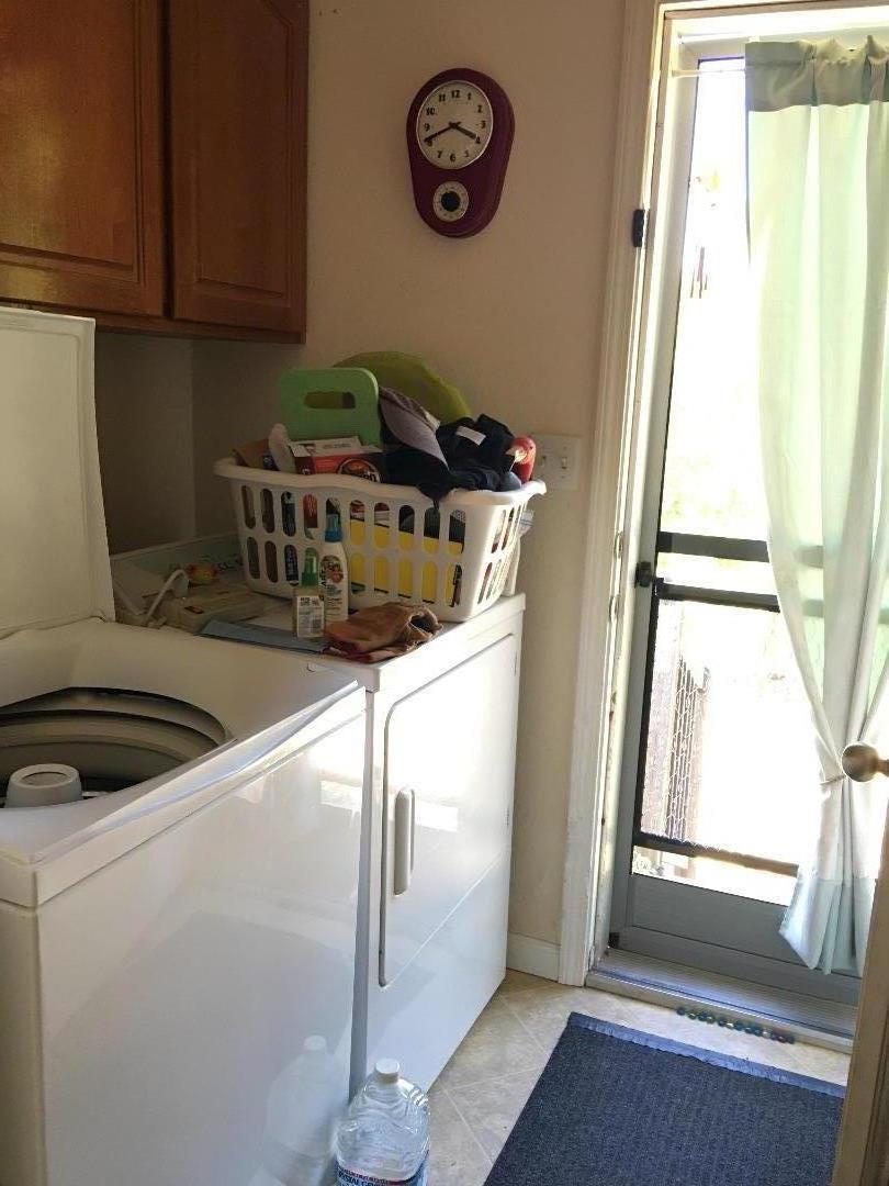 580 Russell Ridge Watsonville, CA 95076 - Photo 34 of 50 a kitchen with a refrigerator a stove and a window
