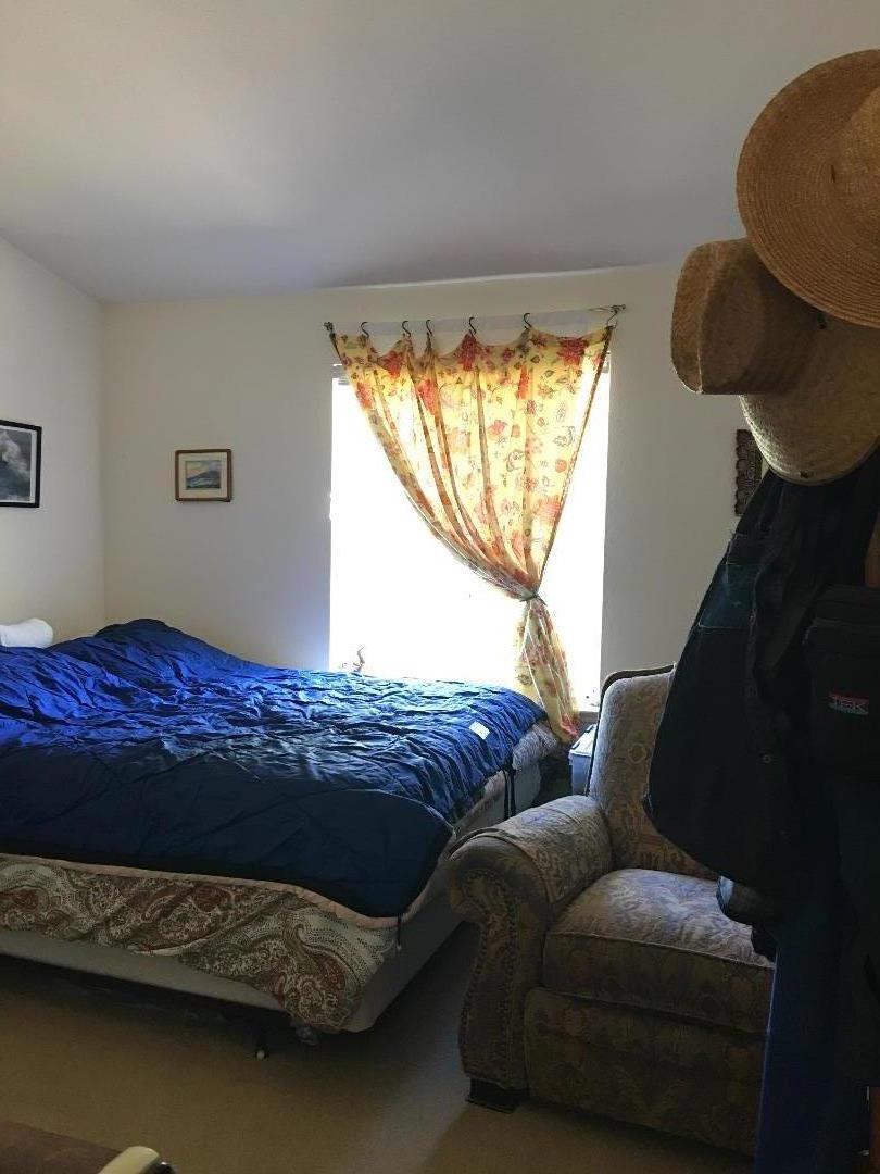 580 Russell Ridge Watsonville, CA 95076 - Photo 39 of 50 a living room with a bed furniture and a window