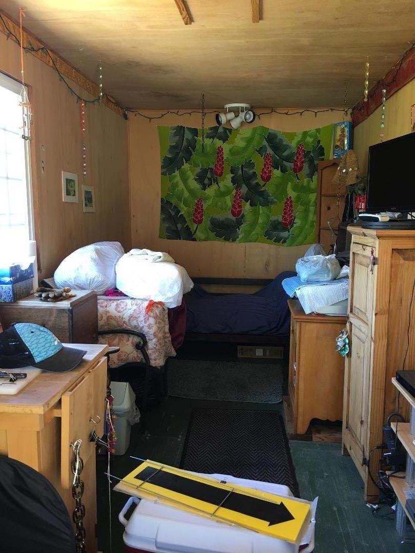 580 Russell Ridge Watsonville, CA 95076 - Photo 47 of 50 a kitchen with stainless steel appliances kitchen island granite countertop a stove a sink and a microwave
