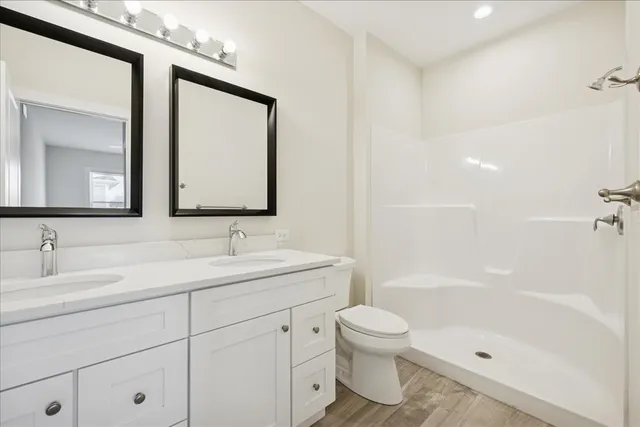 a bathroom with a toilet sink and a mirror