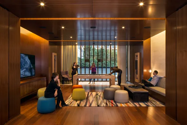 a living room with furniture and floor to ceiling window