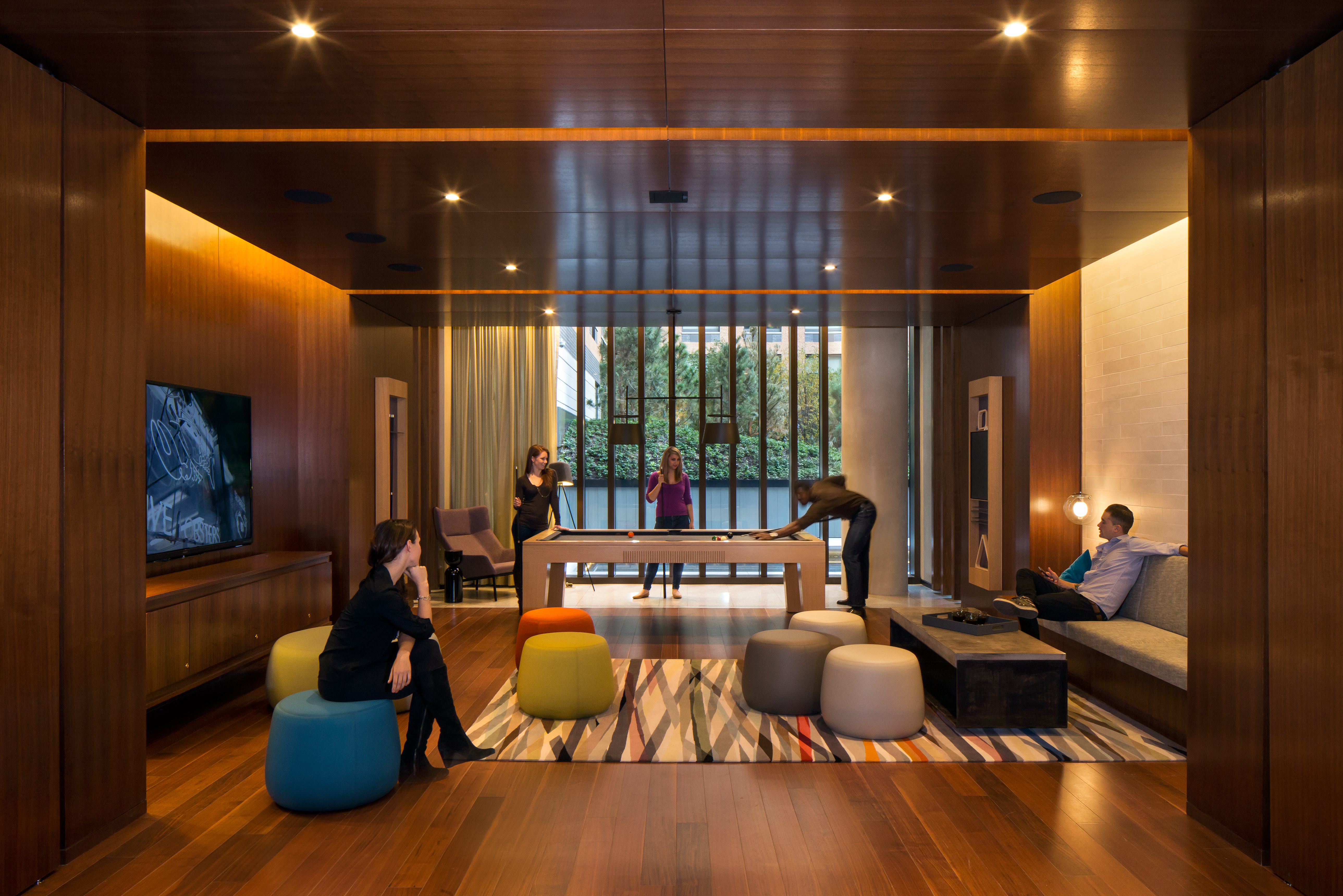 550 West 45th Street, Unit 808 Manhattan, NY 10036 - Photo 6 of 18 a living room with furniture and floor to ceiling window