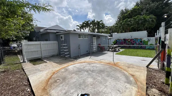 front view of a house with a yard and garage