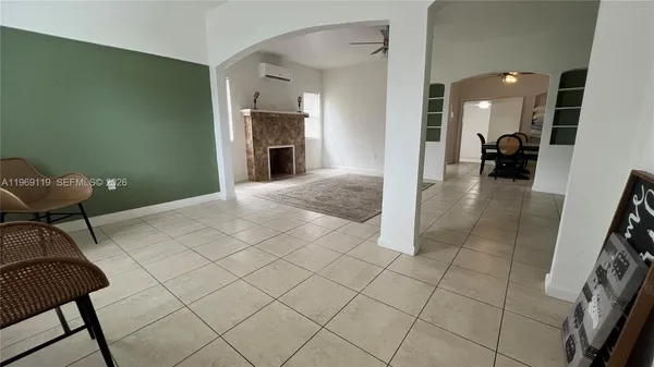 a view of a livingroom with furniture and a fireplace