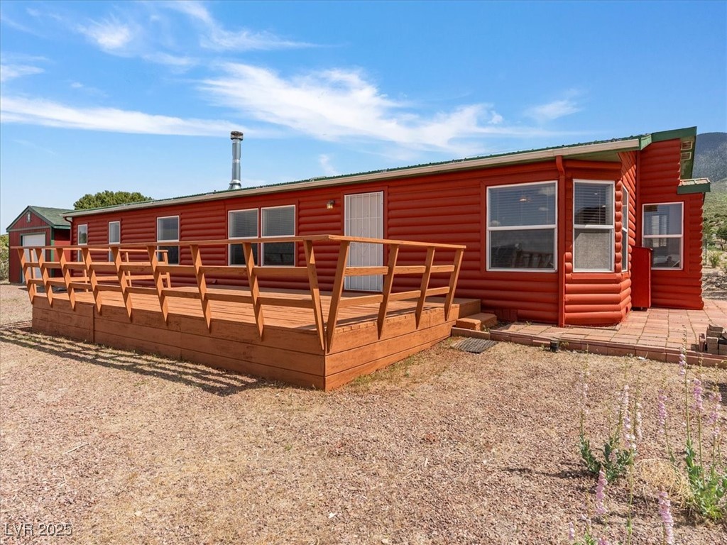 70 West Bonanza Road Las Vegas, NV 89124 - Photo 10 of 71 View of front of home with a wooden deck and faux log siding