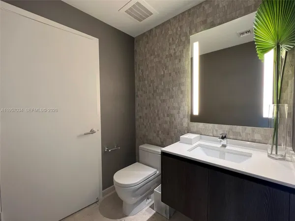 a bathroom with a sink and a toilet