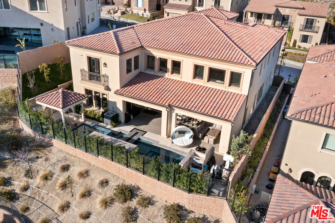 20234 Jubilee Way Porter Ranch, CA 91326 - Photo 2 of 30 a front view of a house with a yard