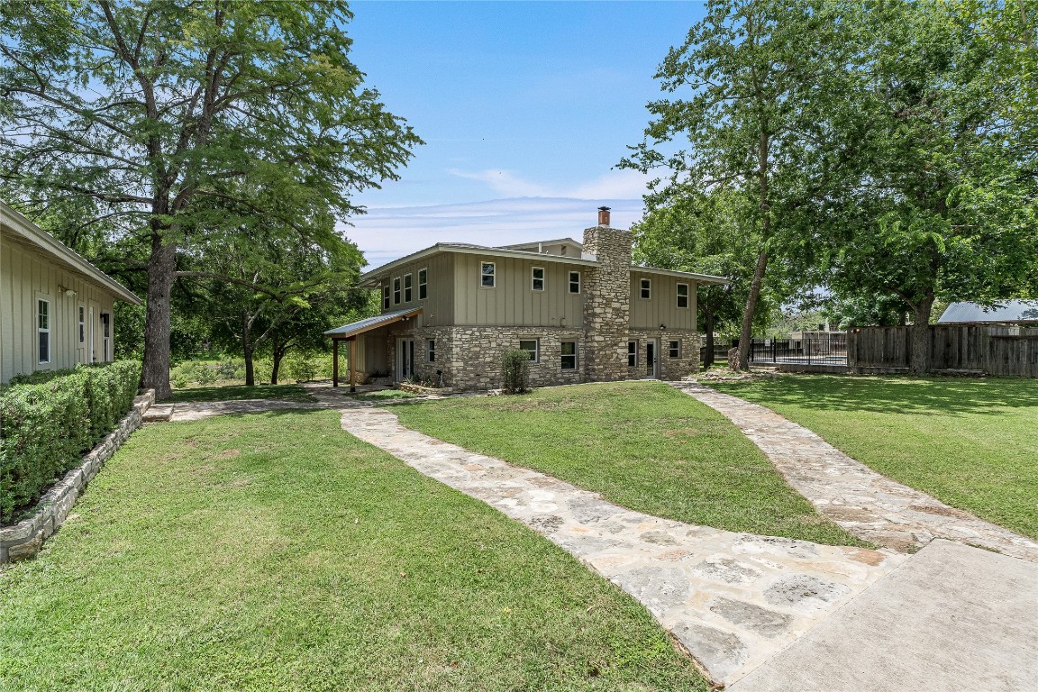 2308 Flite Acres Road Wimberley, TX 78676 - Photo 1 of 35 a view of a house with a yard