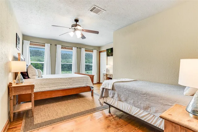 a bedroom with a bed and window