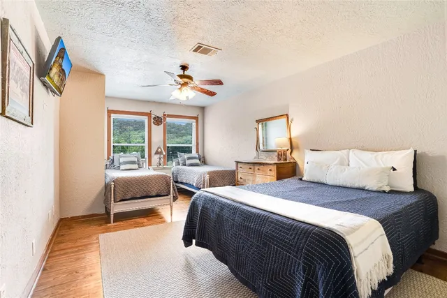 a bedroom with double bed and a window