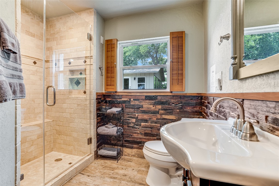 2308 Flite Acres Road Wimberley, TX 78676 - Photo 24 of 35 a bathroom with a sink a toilet and shower