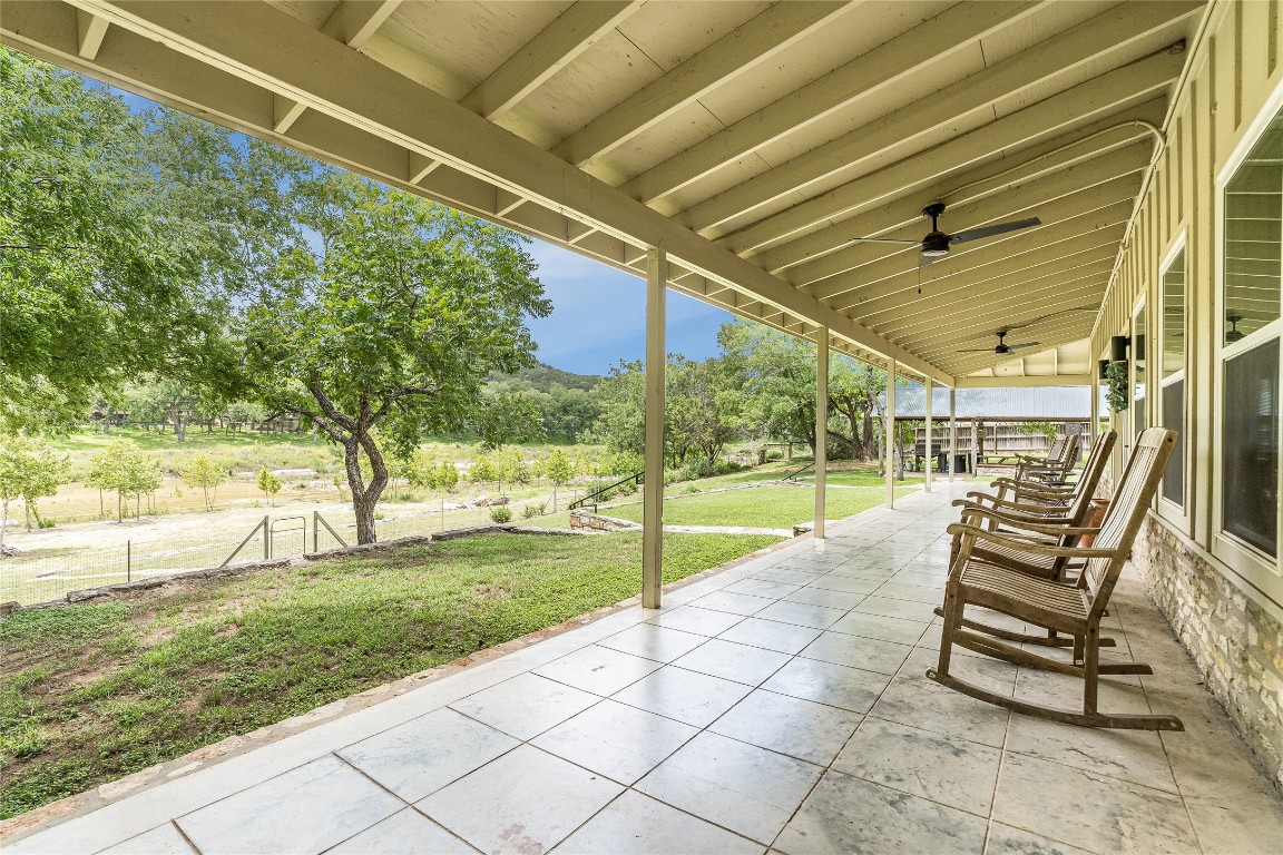 2308 Flite Acres Road Wimberley, TX 78676 - Photo 25 of 35 a view of a porch with furniture and garden