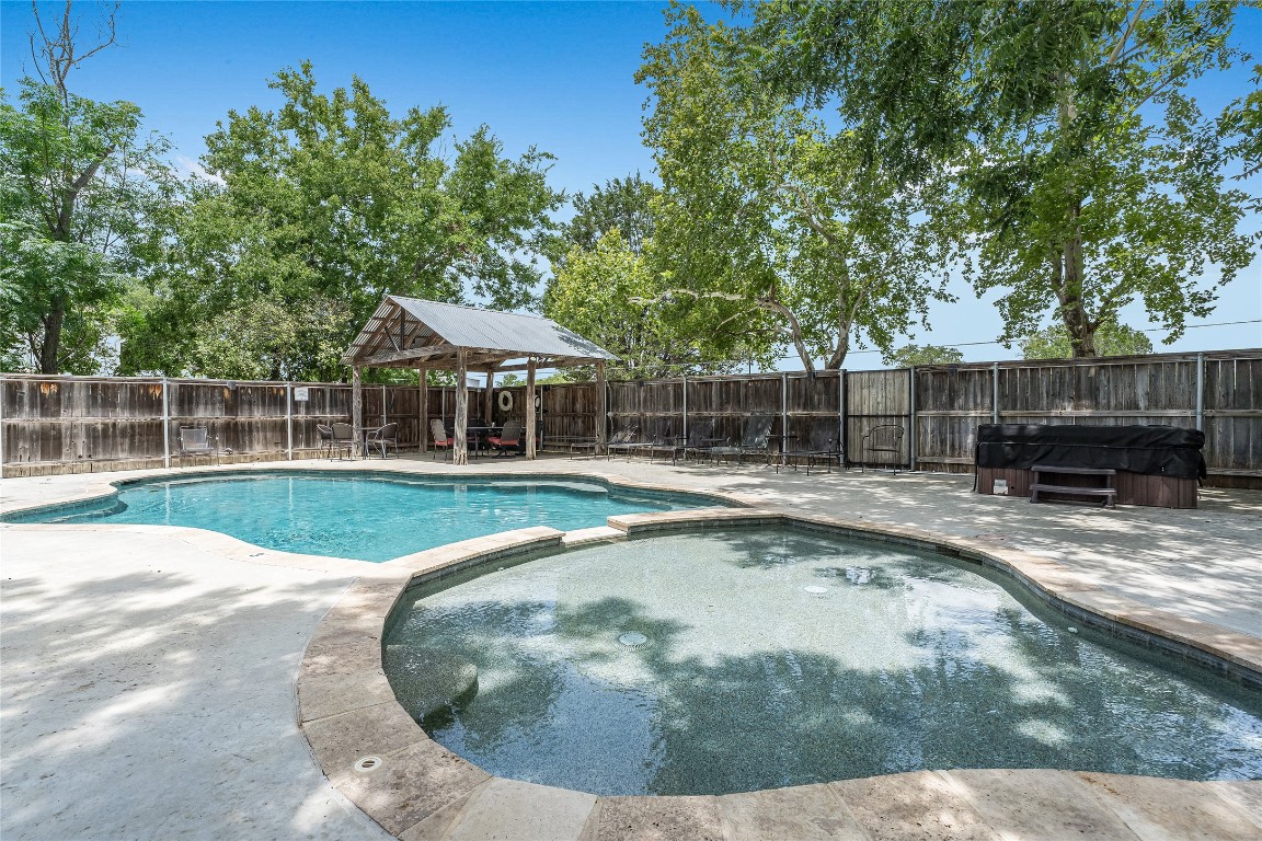 2308 Flite Acres Road Wimberley, TX 78676 - Photo 27 of 35 a view of a swimming pool with a patio