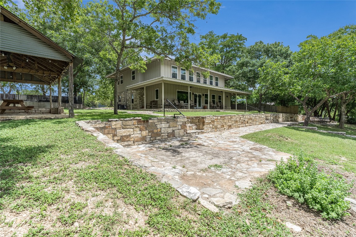 2308 Flite Acres Road Wimberley, TX 78676 - Photo 29 of 35 a front view of a house with a yard