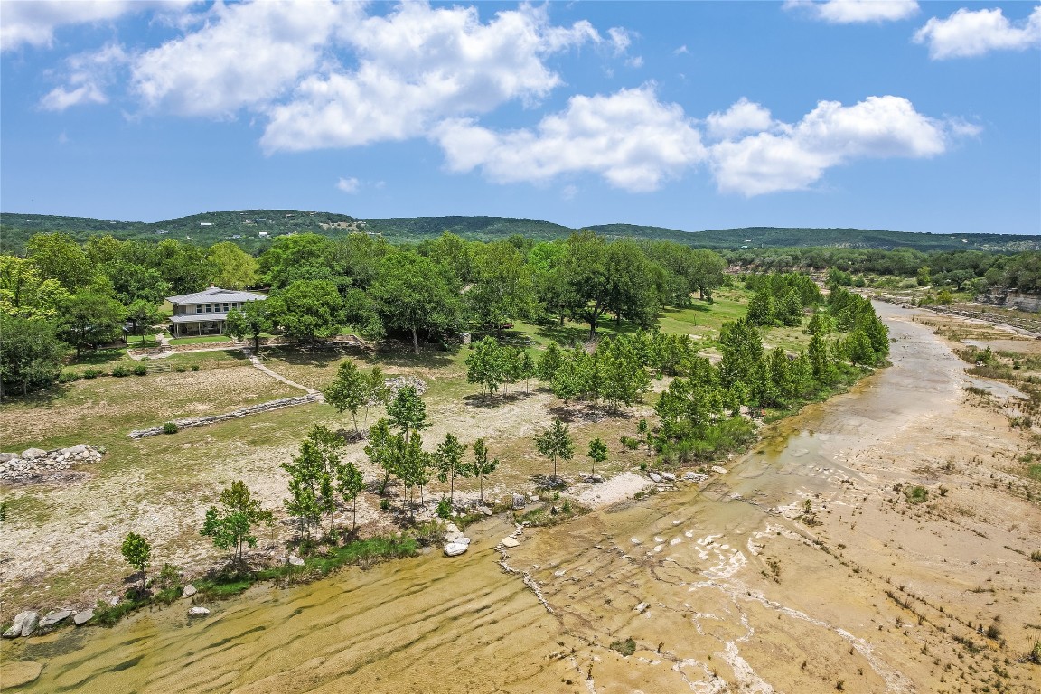 2308 Flite Acres Road Wimberley, TX 78676 - Photo 32 of 35 a view of a lake with a building