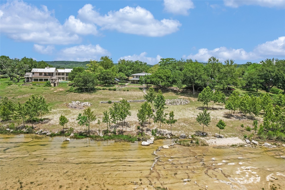 2308 Flite Acres Road Wimberley, TX 78676 - Photo 33 of 35 a view of a lake with a house