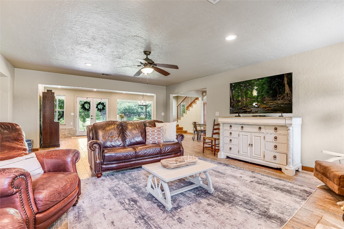 2308 Flite Acres Road Wimberley, TX 78676 - Photo 8 of 35 a living room with furniture and a flat screen tv
